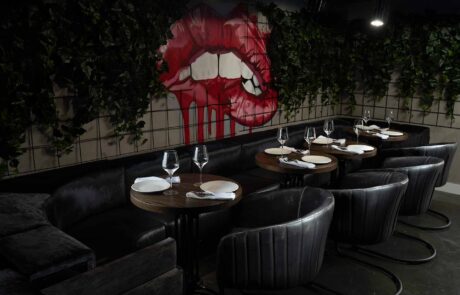 Restaurant dressed table under graffiti of lips